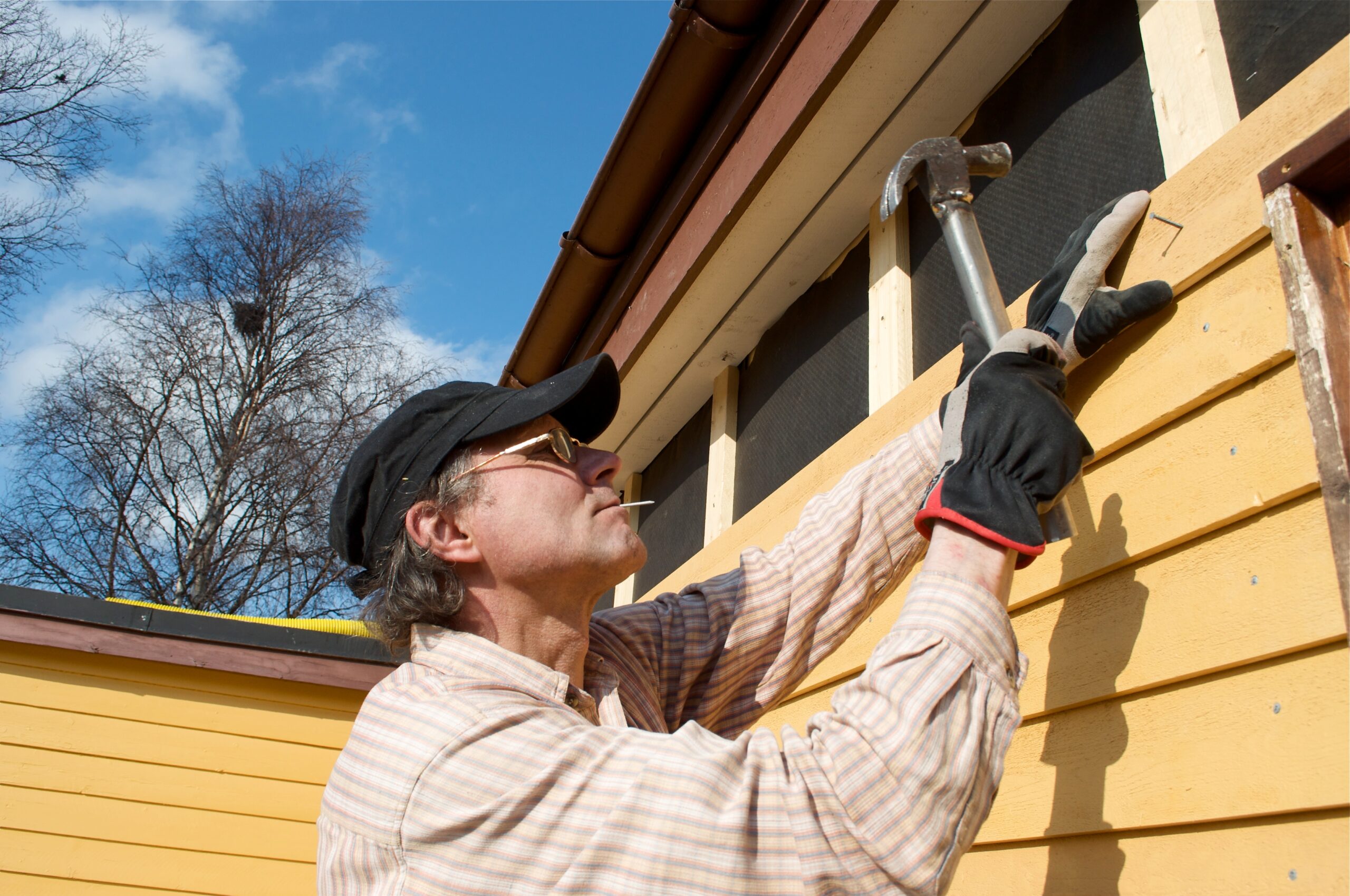 man building a house